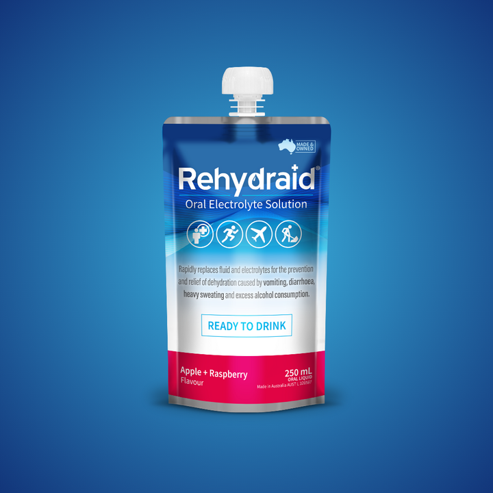 Rehydraid Oral Electrolyte Solution ready-to-drink pouch in apple and raspberry flavor, 250 mL. The packaging highlights it rapidly replaces fluid and electrolytes to relieve dehydration caused by vomiting, diarrhea, heavy sweating, and alcohol consumption. Suitable for physical activity and travel, made in Australia.